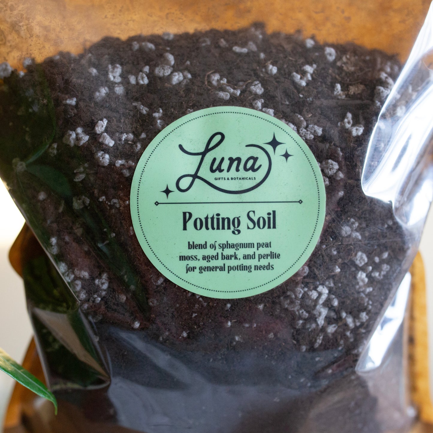Close up photo of label on general potting soil bag. Label reads "blend of sphagnum peat moss, aged bark and perlite for general potting needs"