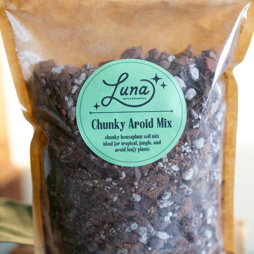 Close up of label of Bag of Luna Chunky Aroid Soil Mixture that reads "Chunky Aroid Mix; chunky houseplant soil mix ideal for tropical, jungle, and aroid leafy plants".